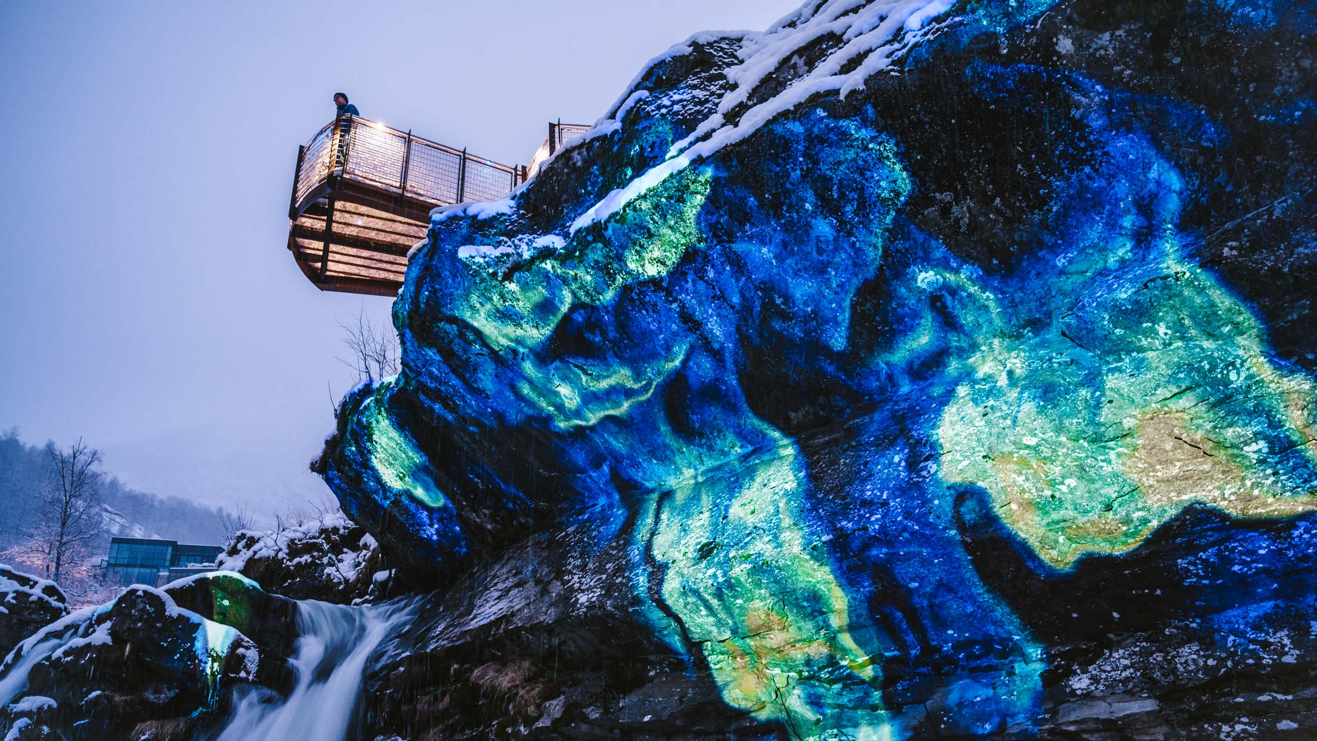 Vide mapping in nature on rocks and waterfall with blue color at geiranger fjord