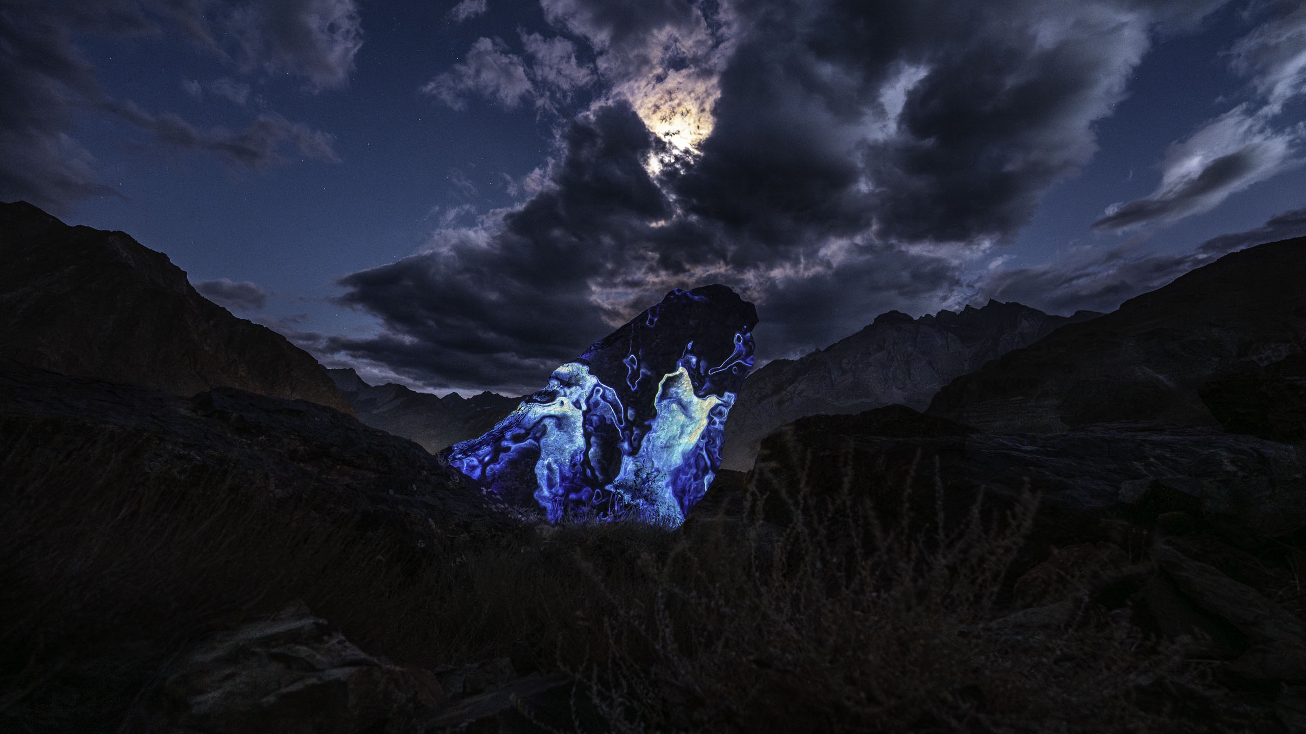 Land art projection mapping on a rock in the Himalayan landscape 
