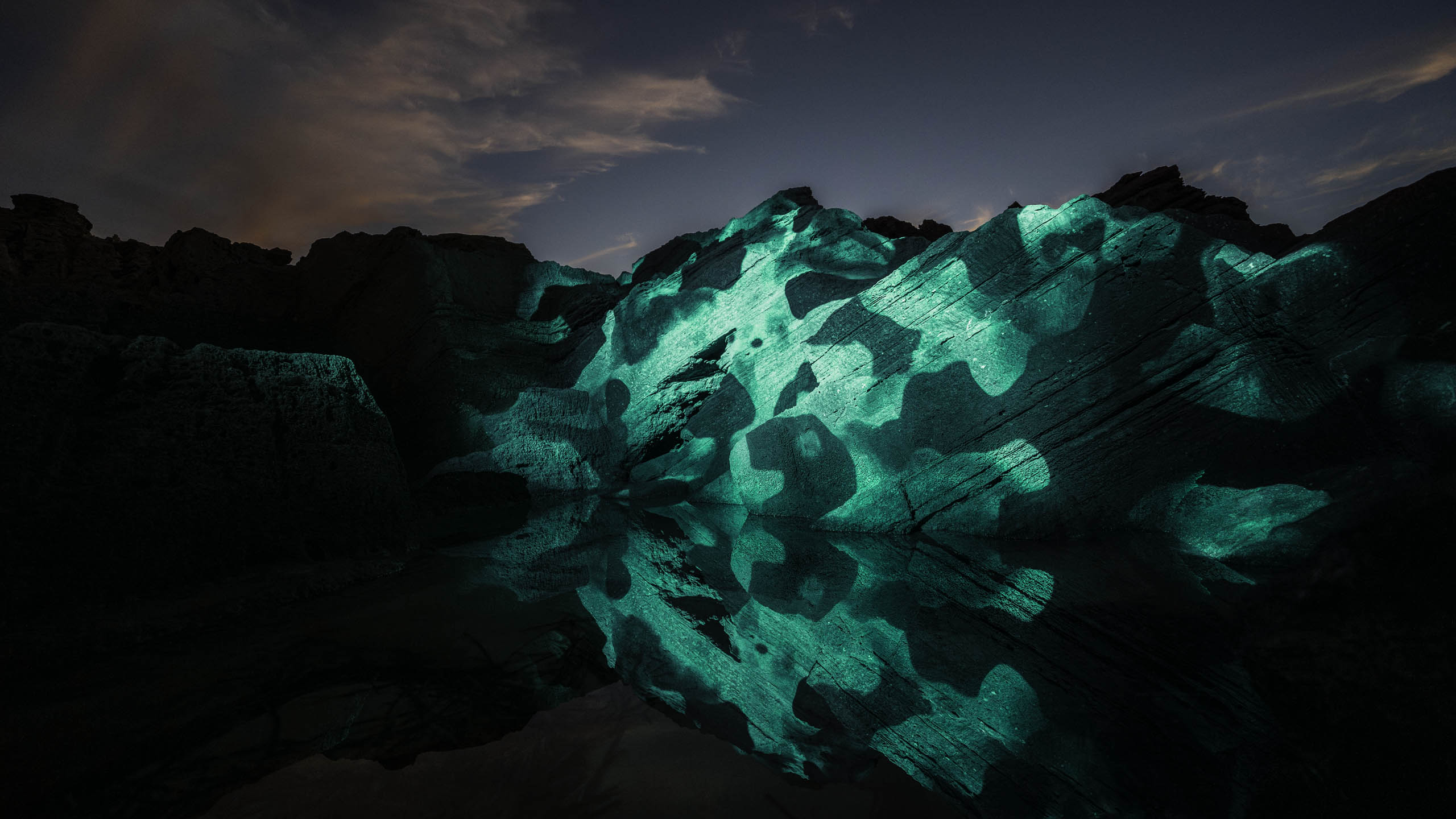 Land Art installation on a Rock structure with water reflections at the coast of Formentera, Spain