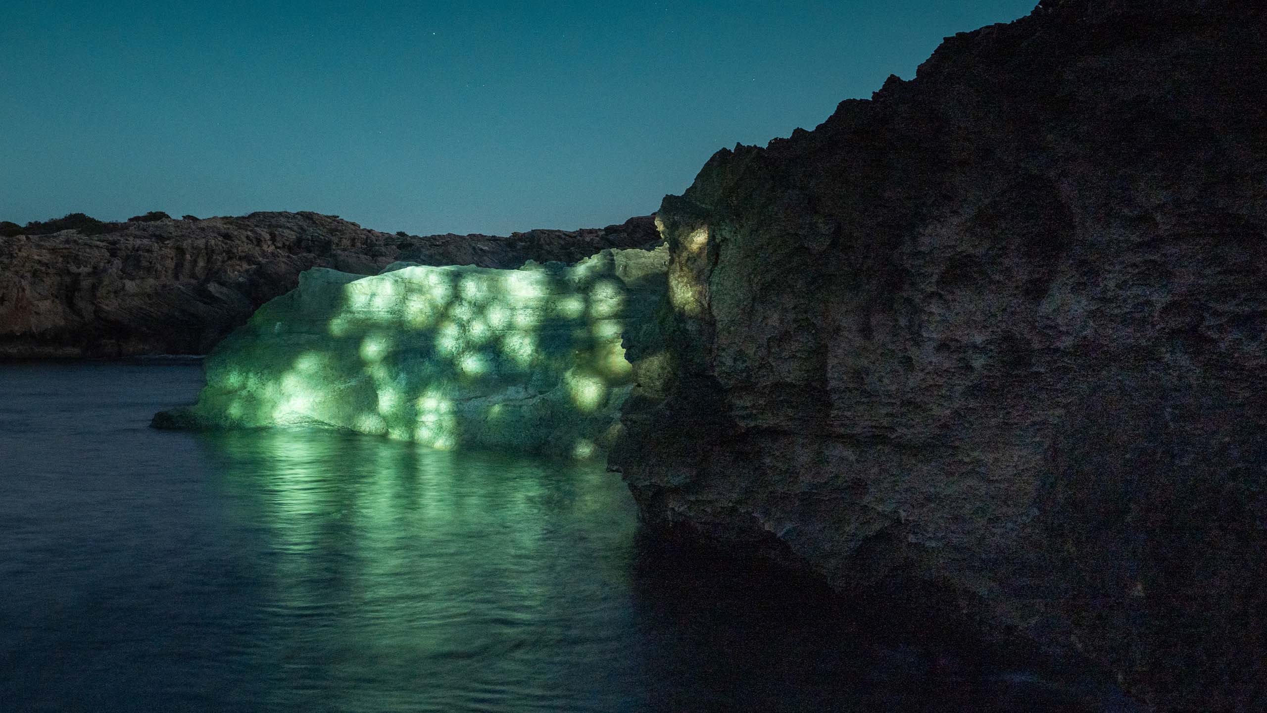 Land art video mapping installation in nature on the coast of Formentera