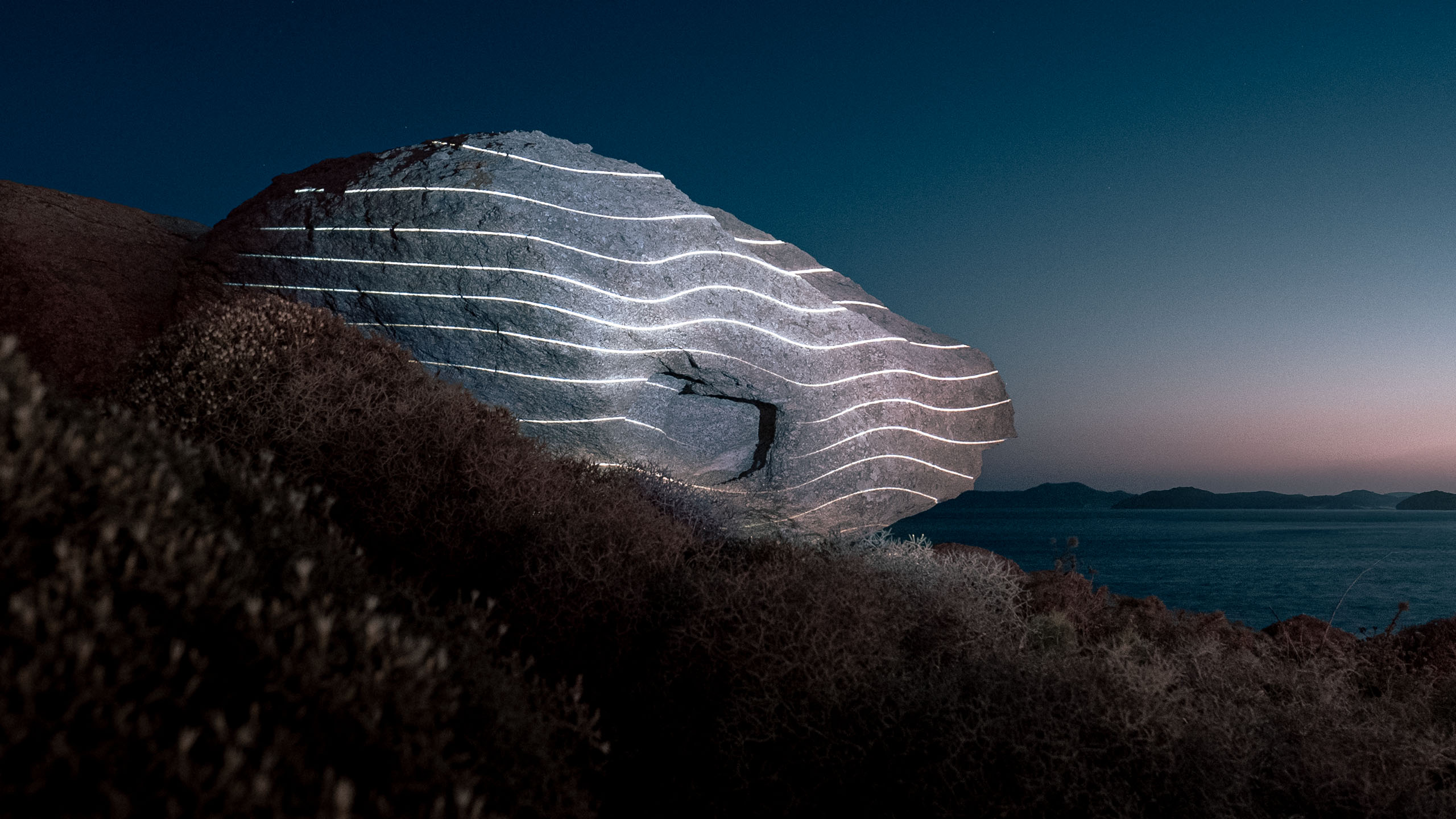 Mykonos Lightcodes_09 White shimmering light projection on natural stone at Scorpios Mykonos, site-specific light installation.